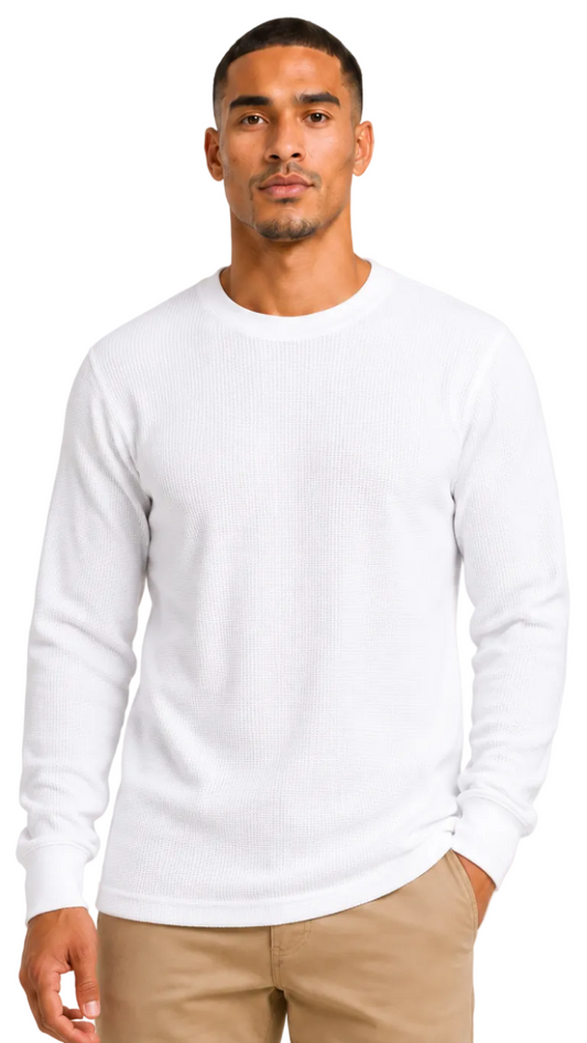 Man wearing a white long-sleeve shirt against a plain background