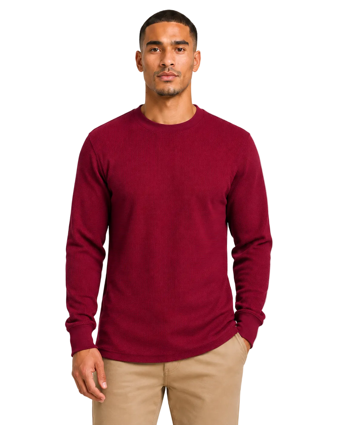 Man wearing a burgundy sweater and beige pants on a light gray background