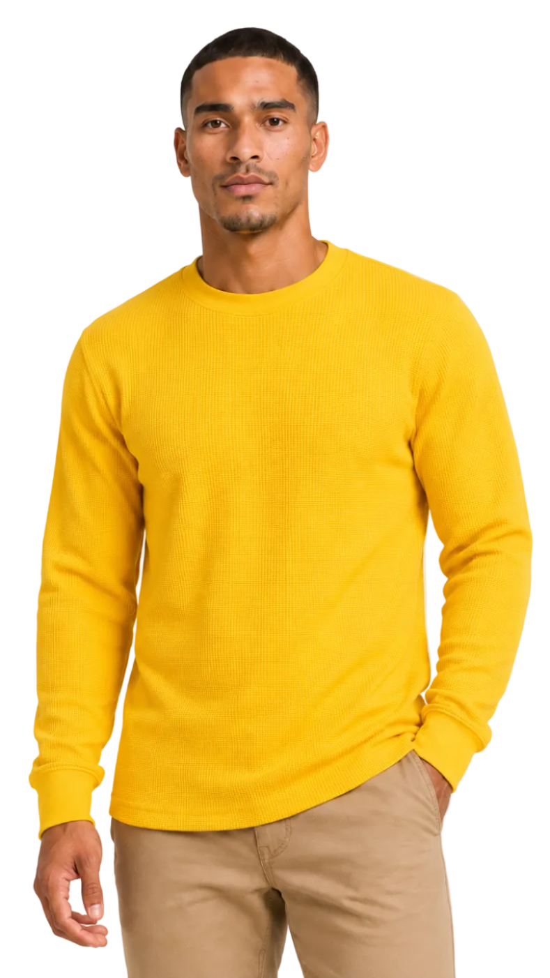 Man wearing a yellow long-sleeve shirt against a plain background