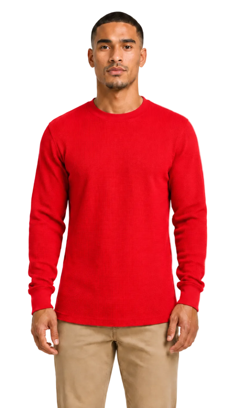 Man wearing a red long-sleeve shirt and beige pants on a white background